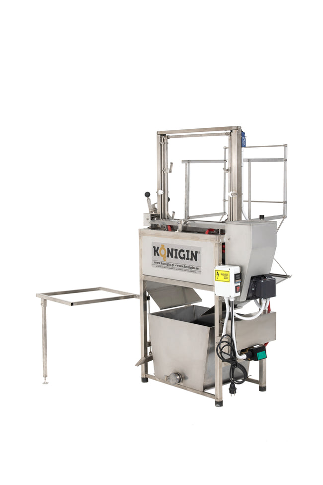 Konigin uncapping machine with heated vibrating blades