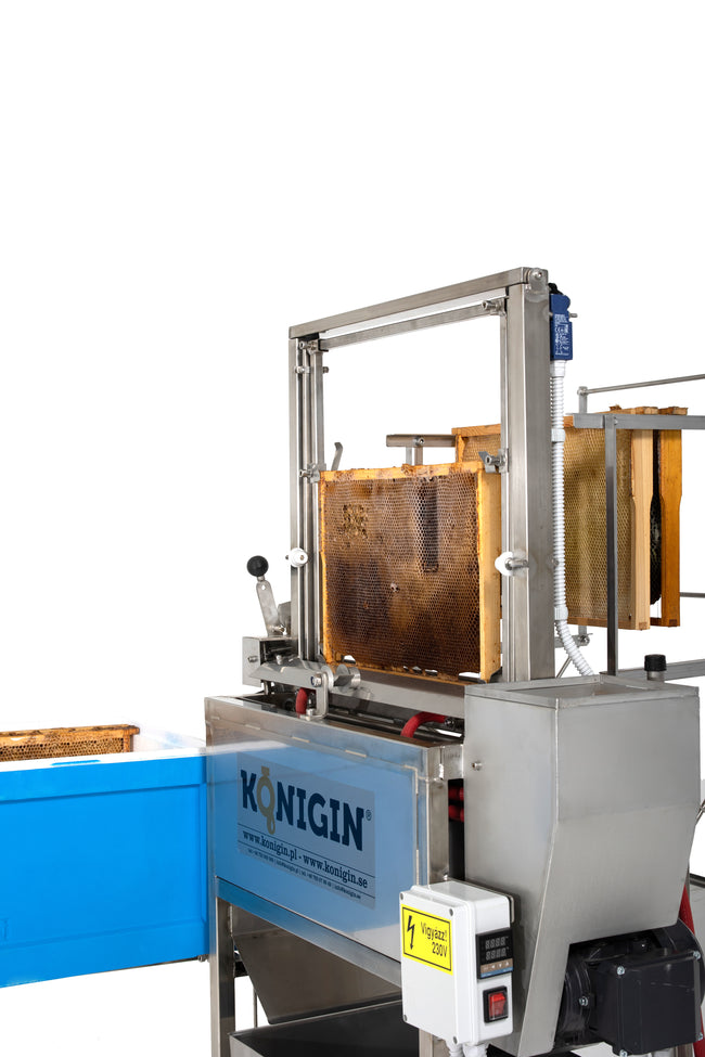 Konigin uncapping machine with heated vibrating blades
